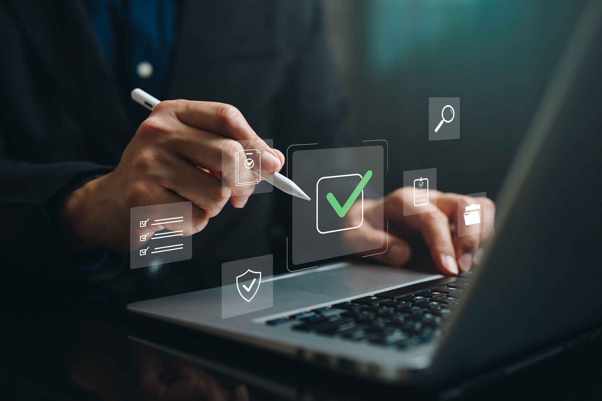 Professional using a stylus to complete a digital approval checklist on a laptop, representing the verification and quality control steps in ERP migration services.
